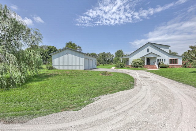 view of front of property with a garage and a front lawn