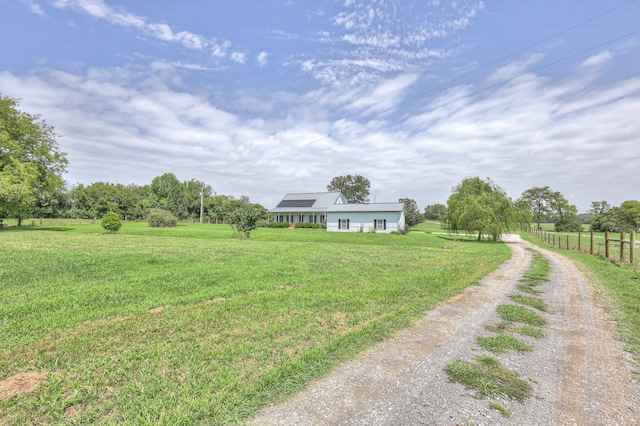 view of yard with a rural view