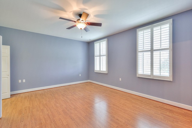 unfurnished room with ceiling fan and light wood-type flooring