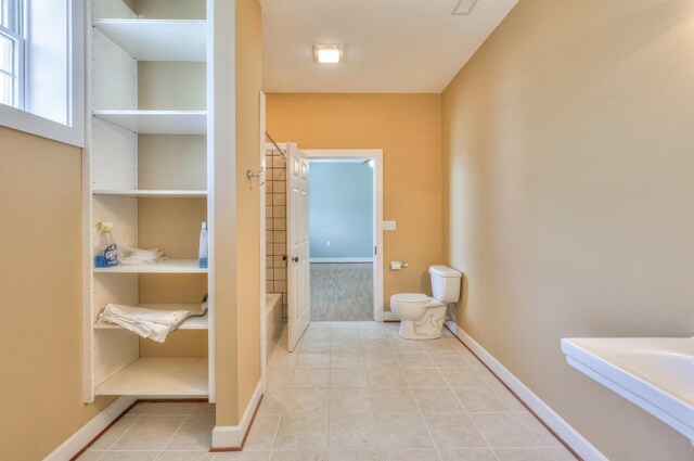 bathroom featuring tile patterned floors and toilet