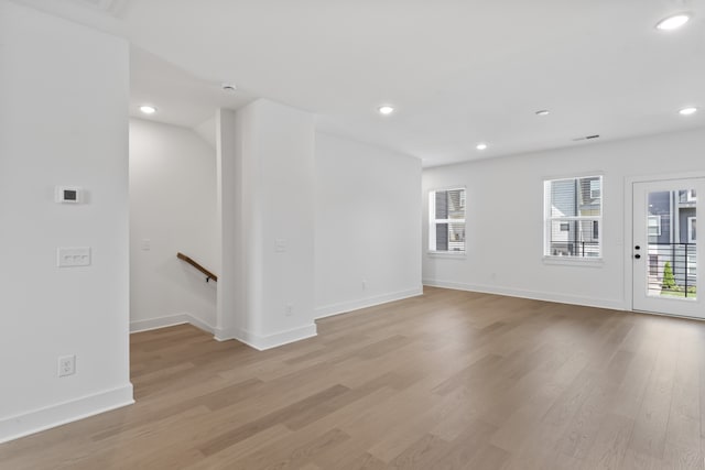 unfurnished room with light hardwood / wood-style flooring