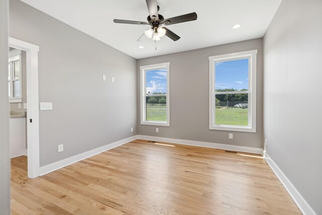 unfurnished room featuring ceiling fan and light hardwood / wood-style floors