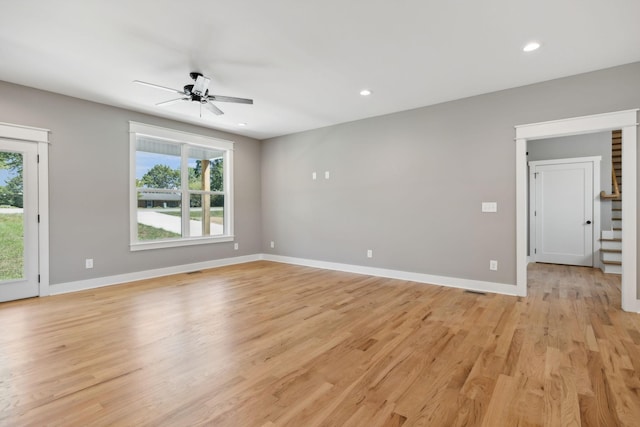 unfurnished living room featuring light wood-type flooring, ceiling fan, baseboards, and recessed lighting