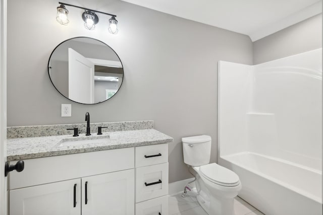 full bathroom featuring vanity, toilet, and baseboards