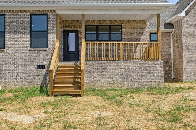 entrance to property with covered porch