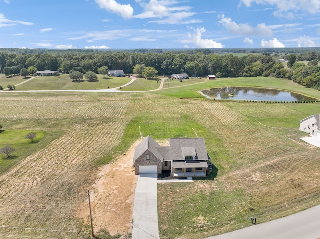 birds eye view of property featuring a rural view and a water view