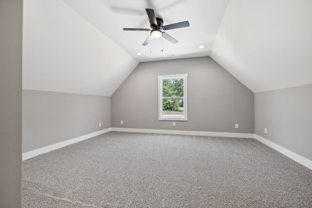 bonus room featuring carpet flooring, ceiling fan, and vaulted ceiling