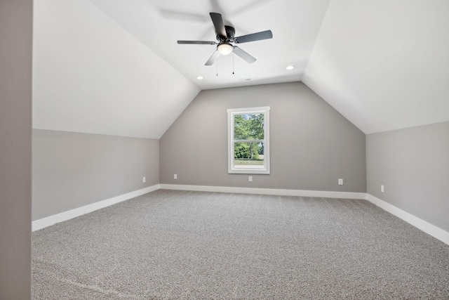 additional living space with baseboards, ceiling fan, vaulted ceiling, carpet flooring, and recessed lighting