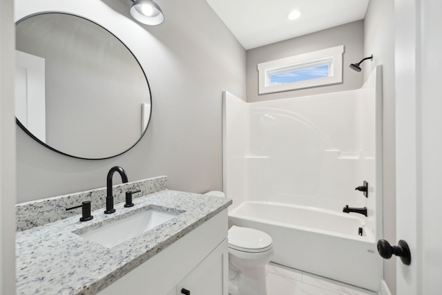 full bathroom featuring vanity, toilet, and washtub / shower combination