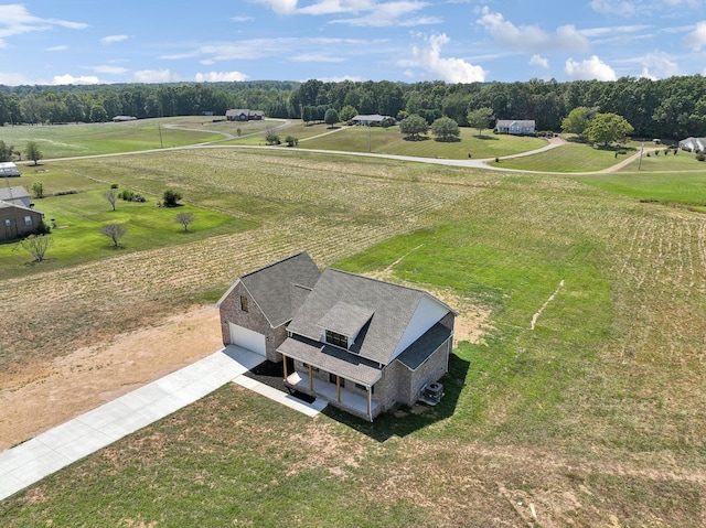 birds eye view of property with a rural view