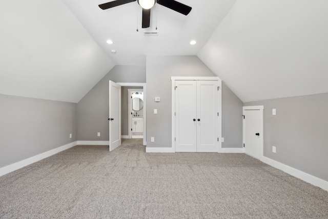 bonus room featuring light colored carpet, ceiling fan, and lofted ceiling