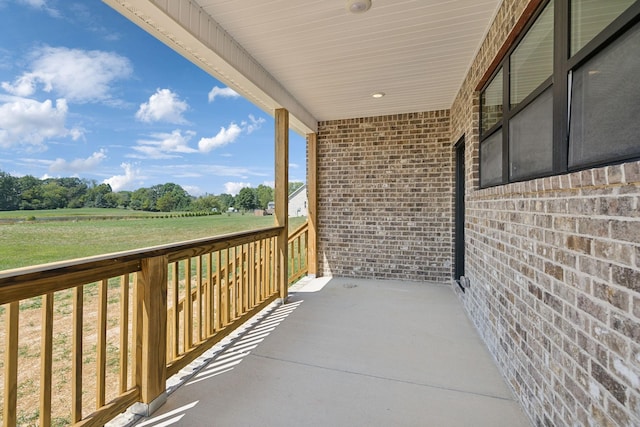 balcony featuring a rural view