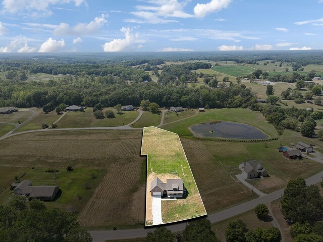 birds eye view of property featuring a rural view