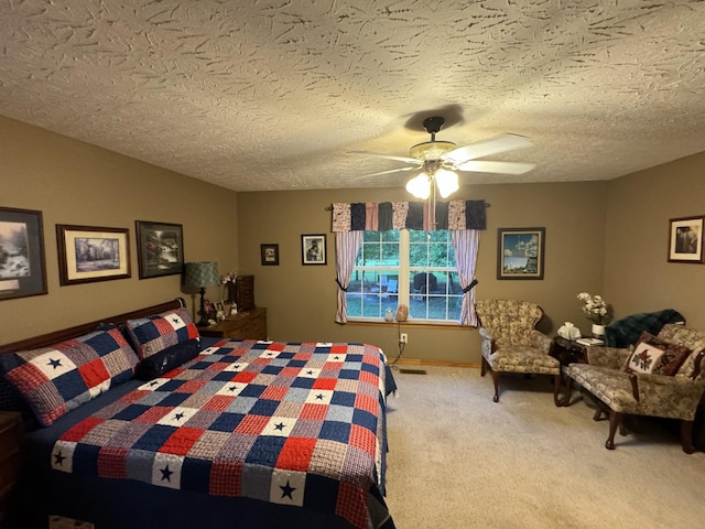 bedroom with vaulted ceiling, carpet flooring, a textured ceiling, and ceiling fan