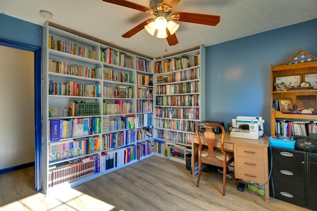 office space featuring wood-type flooring, ceiling fan, and a textured ceiling