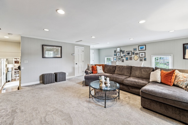 living room featuring light colored carpet and ornamental molding