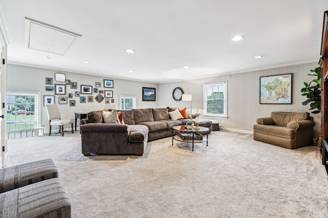 carpeted living room with crown molding