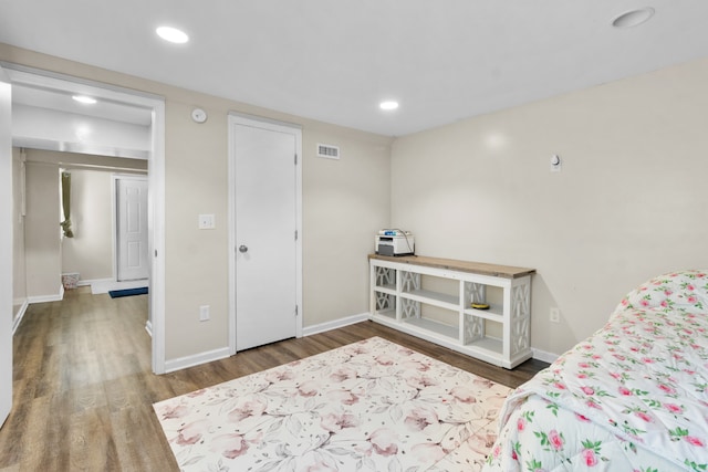 bedroom with hardwood / wood-style floors