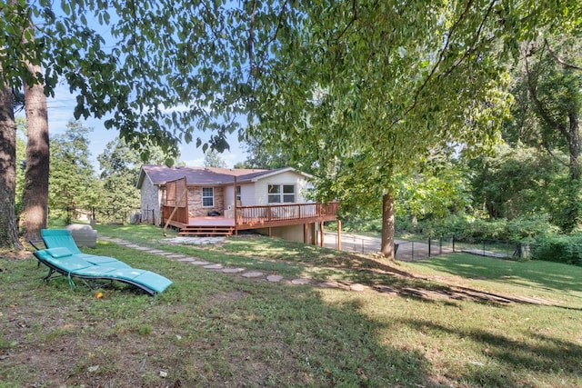 view of yard with a wooden deck