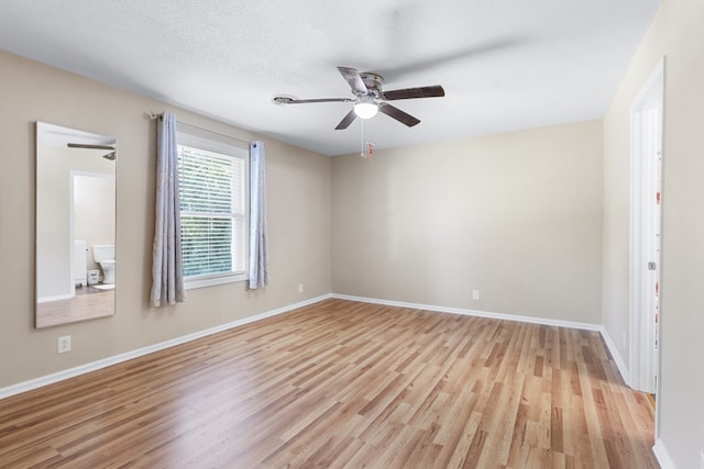 unfurnished room featuring light hardwood / wood-style floors and ceiling fan