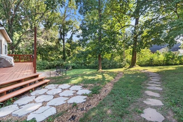 view of yard with a wooden deck