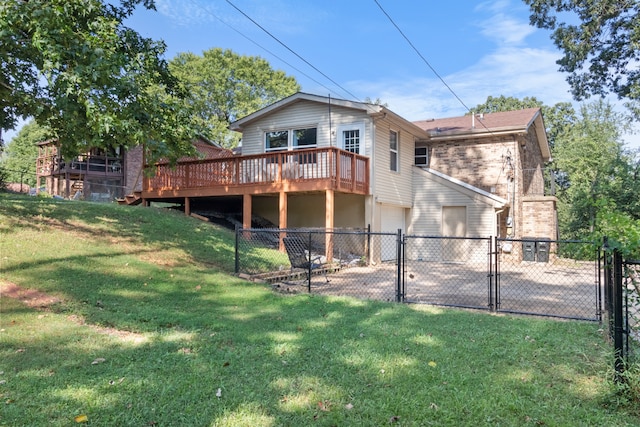 back of property featuring a wooden deck and a lawn