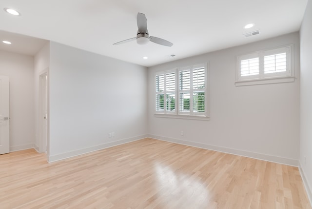 spare room featuring ceiling fan and light hardwood / wood-style flooring