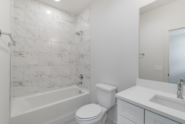 full bathroom featuring vanity, toilet, and tiled shower / bath