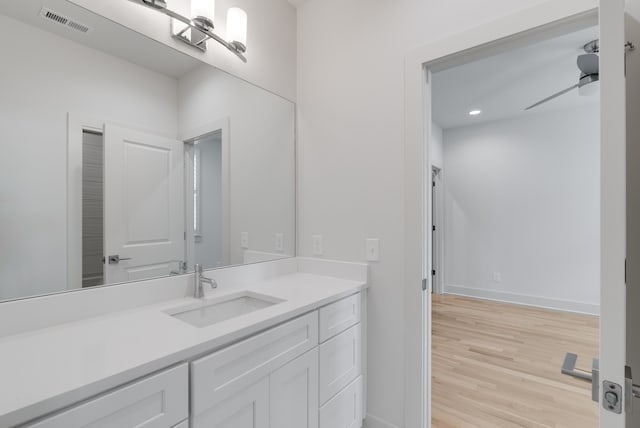 bathroom featuring vanity and wood-type flooring