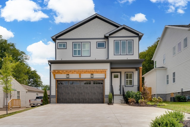 craftsman inspired home featuring a porch and a garage