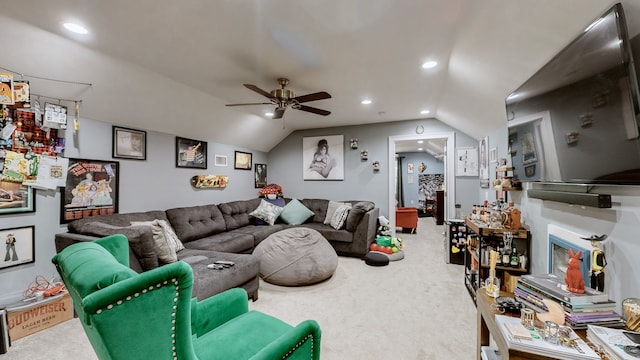 living room with ceiling fan, vaulted ceiling, and carpet floors