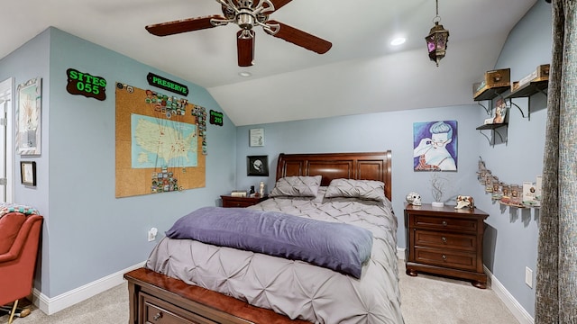 carpeted bedroom featuring ceiling fan and vaulted ceiling