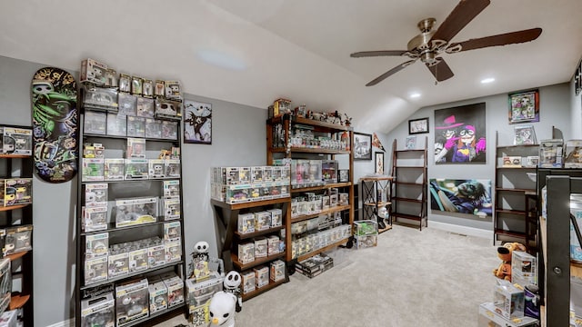 miscellaneous room with ceiling fan, vaulted ceiling, and light carpet