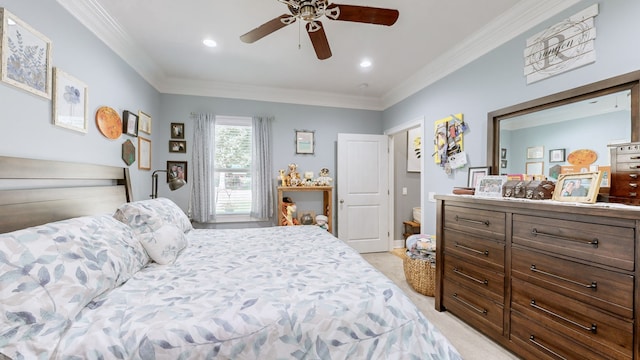 bedroom with ceiling fan, crown molding, and light colored carpet