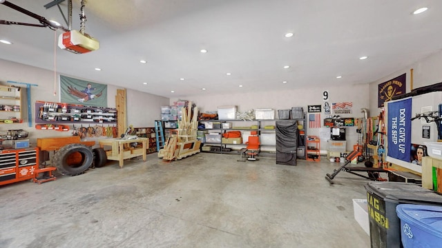 1019 Parker Rd, Kingston Springs, TN 37082 - garage with a workshop area, recessed lighting, and a garage door opener