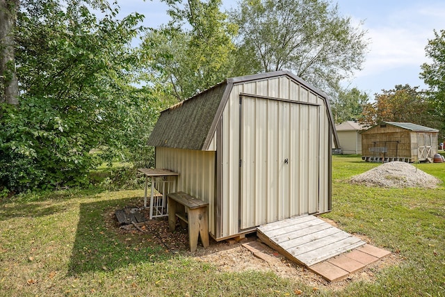 view of outbuilding with a lawn