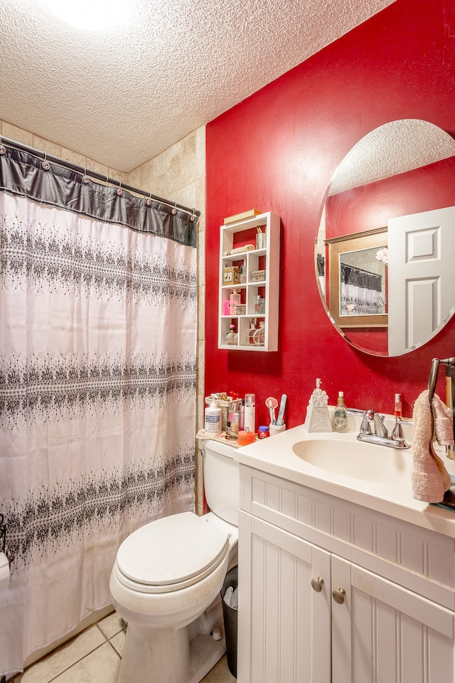 bathroom featuring a textured ceiling, toilet, vanity, and tile patterned floors