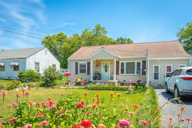 view of front of property with a front lawn