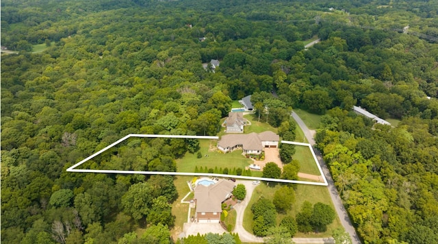 aerial view with a wooded view