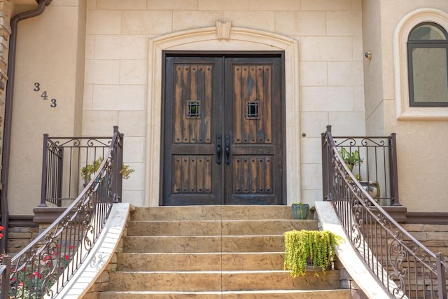 entrance to property with stone siding