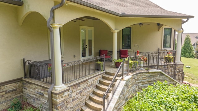 property entrance featuring french doors, roof with shingles, ceiling fan, and stucco siding