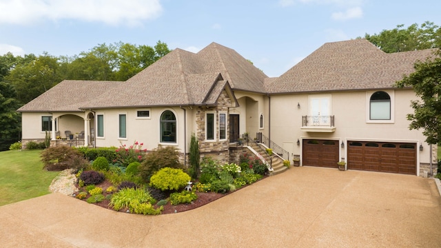 view of front of home with a garage and a front yard