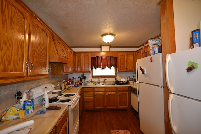 kitchen featuring backsplash, dark hardwood / wood-style floors, sink, a textured ceiling, and white appliances