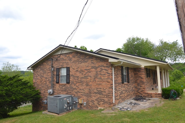 view of property exterior featuring a yard and cooling unit