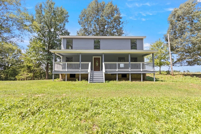 rear view of property with a lawn