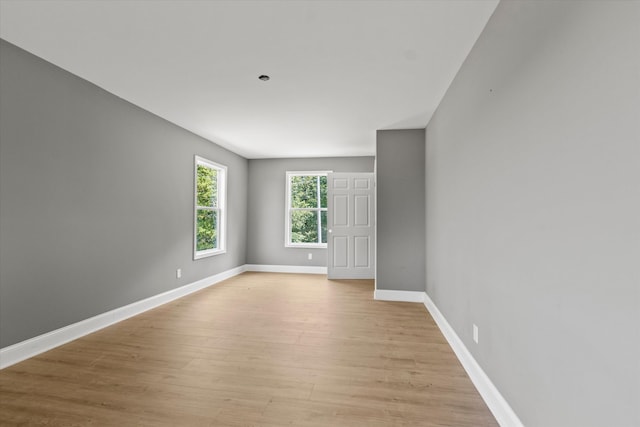 spare room featuring light hardwood / wood-style flooring