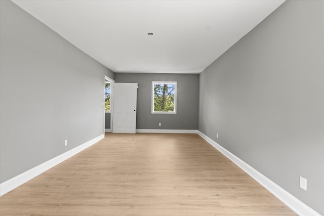 spare room featuring light hardwood / wood-style floors