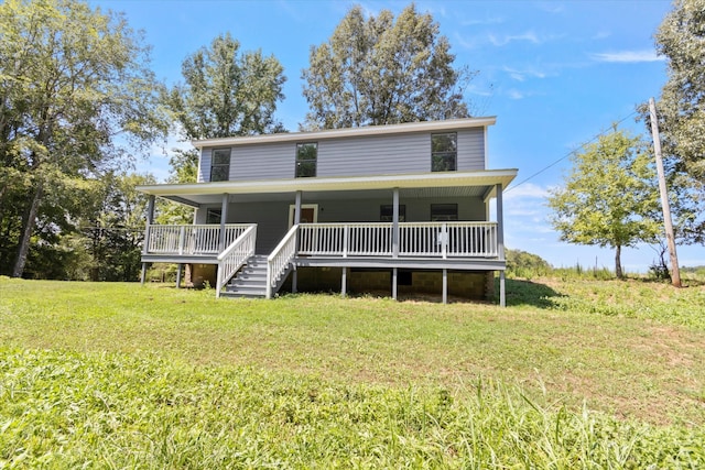 rear view of property featuring a lawn and a wooden deck