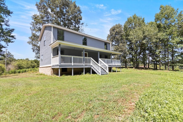 back of house featuring a yard