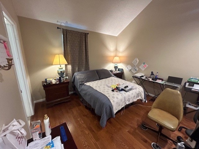 bedroom with hardwood / wood-style floors